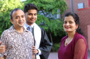 Shreejal with his parents.