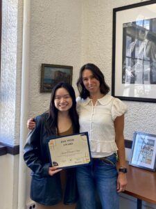 Xenia Chen receiving her BMC Peer Award from Marcia Breslin-Cantillana